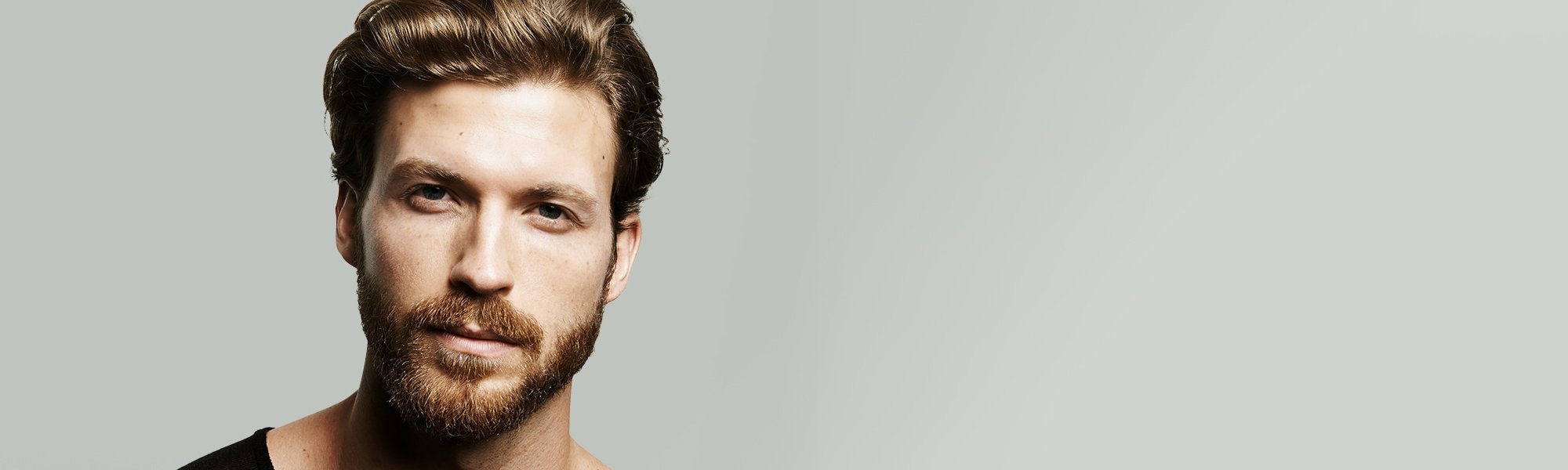 L'Oréal Men Expert Hero - Mann mit Bart schaut bestimmt.