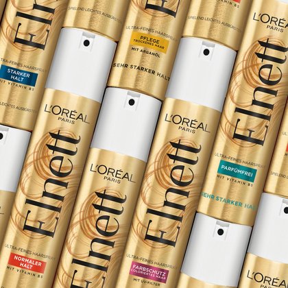 Verschiedene Elnett Haarsprays nebeneinander liegend