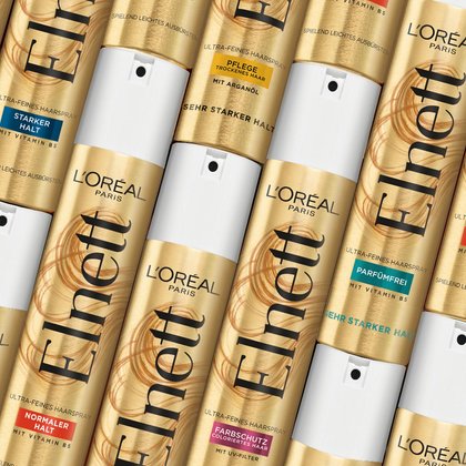 Verschiedene Elnett Haarsprays nebeneinander liegend