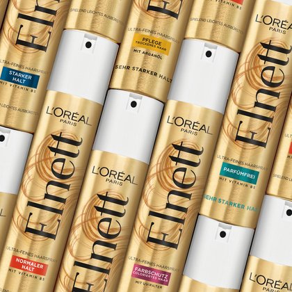 Verschiedene Elnett Haarsprays nebeneinander liegend