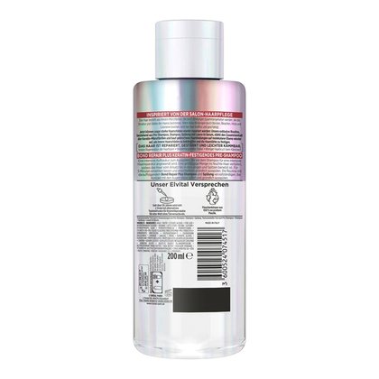 Produktabbildung der Rückseite der Pre-Shampooflasche (200 ml) mit Details zur Anwendung (auf feuchtem Haar vor dem Shampoo einwirken lassen), dem Elvital-Versprechen, Entsorgungshinweisen (Gelbe Tonne), Barcode und der Liste der Inhaltsstoffe (Ingredients wie Aqua, Cetearyl Alcohol, Glycerin, etc.).