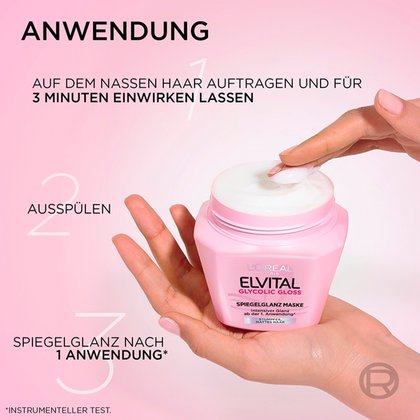 Hände halten den geöffneten rosa Tiegel der Elvital Maske mit Anwendungsanleitung.