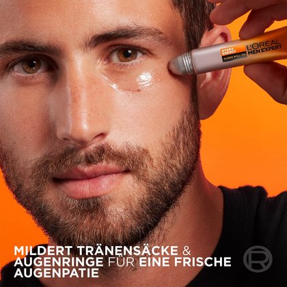 Mann trägt Hydra Energy Anti-Müdigkeit Augen Roll-On unter sein linkes Auge auf