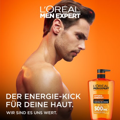 Ein Mann zeigt seinen Rücken neben einer Hydra Energy 1L Spenderflasche.